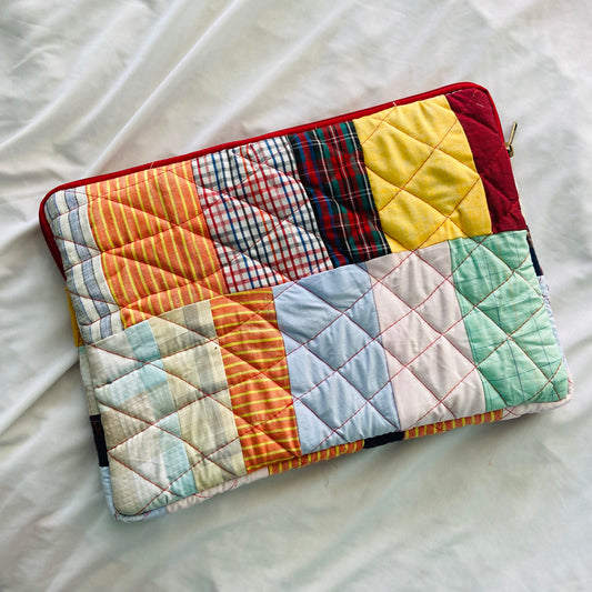 laptop cover, case cover for macbook air, cover for hp laptop, laptop sleeves all sizes, cute laptop sleeves, quilted laptop cover, puffy laptop sleeve, laptop sleeve 13 inch macbook air, laptop sleeve, laptop sleeve custom size, laptop cover 15 inch, An eco-friendly laptop sleeve showcasing a mix of vibrant, multicolor solid patchwork fabric pieces, creating a bold and eye-catching design. The quilted, puffy construction ensures your laptop is well-protected.