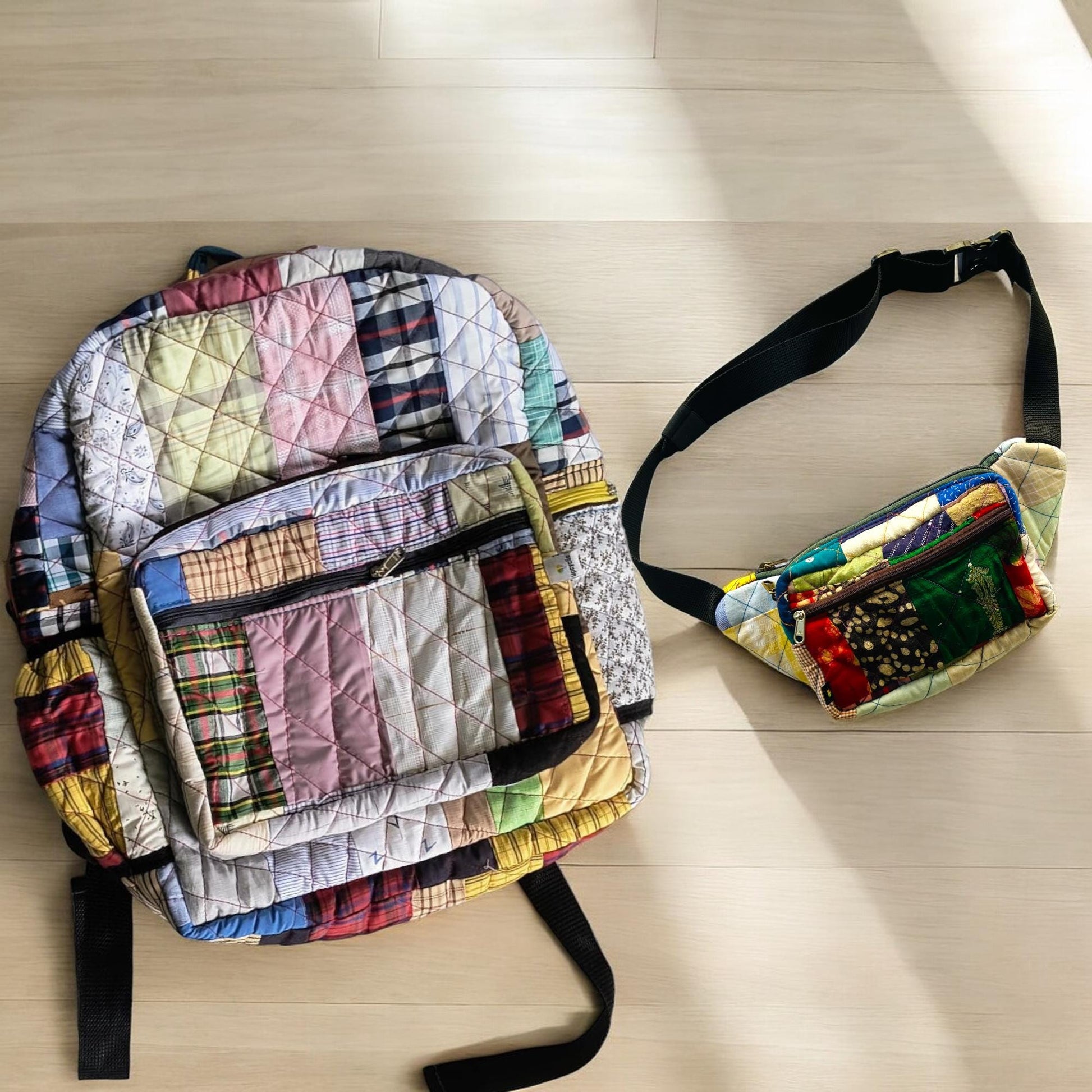 Multicolored upcycled patchwork backpack with coordinated fanny pack on a sunlit wooden floor. The vibrant fabrics feature plaid and block patterns, with quilted texture and durable zippers. Perfect as a travel set for eco-conscious adventurers. Great for gifting, festivals, or daily errands. A zero-waste fashion solution crafted by artisans using tailoring extras saved from landfill.