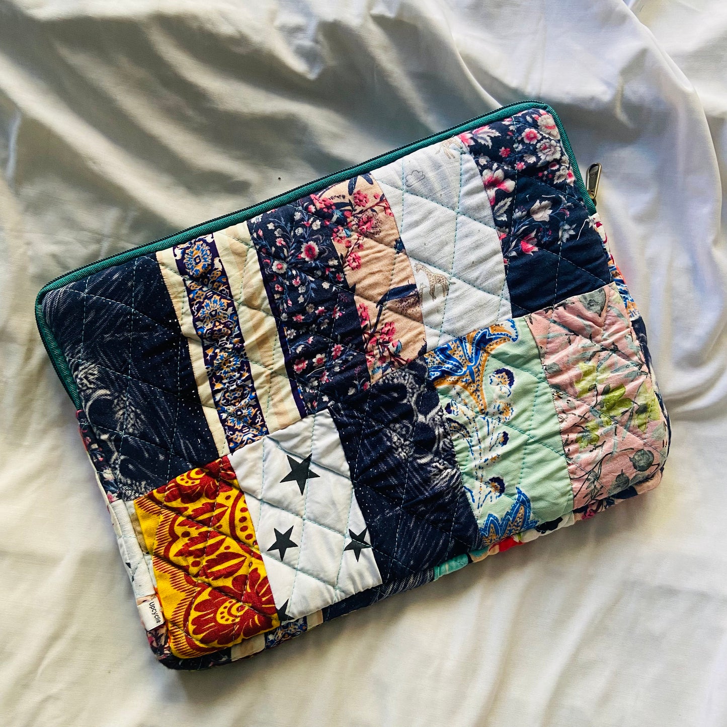 laptop cover, case cover for macbook air, cover for hp laptop, laptop sleeves all sizes, cute laptop sleeves, quilted laptop cover, puffy laptop sleeve, laptop sleeve 13 inch macbook air, laptop sleeve, laptop sleeve custom size, laptop cover 15 inch, An eco-friendly laptop sleeve showcasing a mix of vibrant, multicolor solid patchwork fabric pieces, creating a bold and eye-catching design. The quilted, puffy construction ensures your laptop is well-protected.