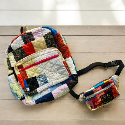 Colorful quilted backpack and fanny pack made from rescued fabric remnants, displayed on a light wooden surface. The bold patchwork design and handcrafted finish make this combo ideal for sustainable living. Great for school, travel, or gifting. Designed to promote conscious fashion while keeping functionality in mind for adventurous, eco-minded women and students.