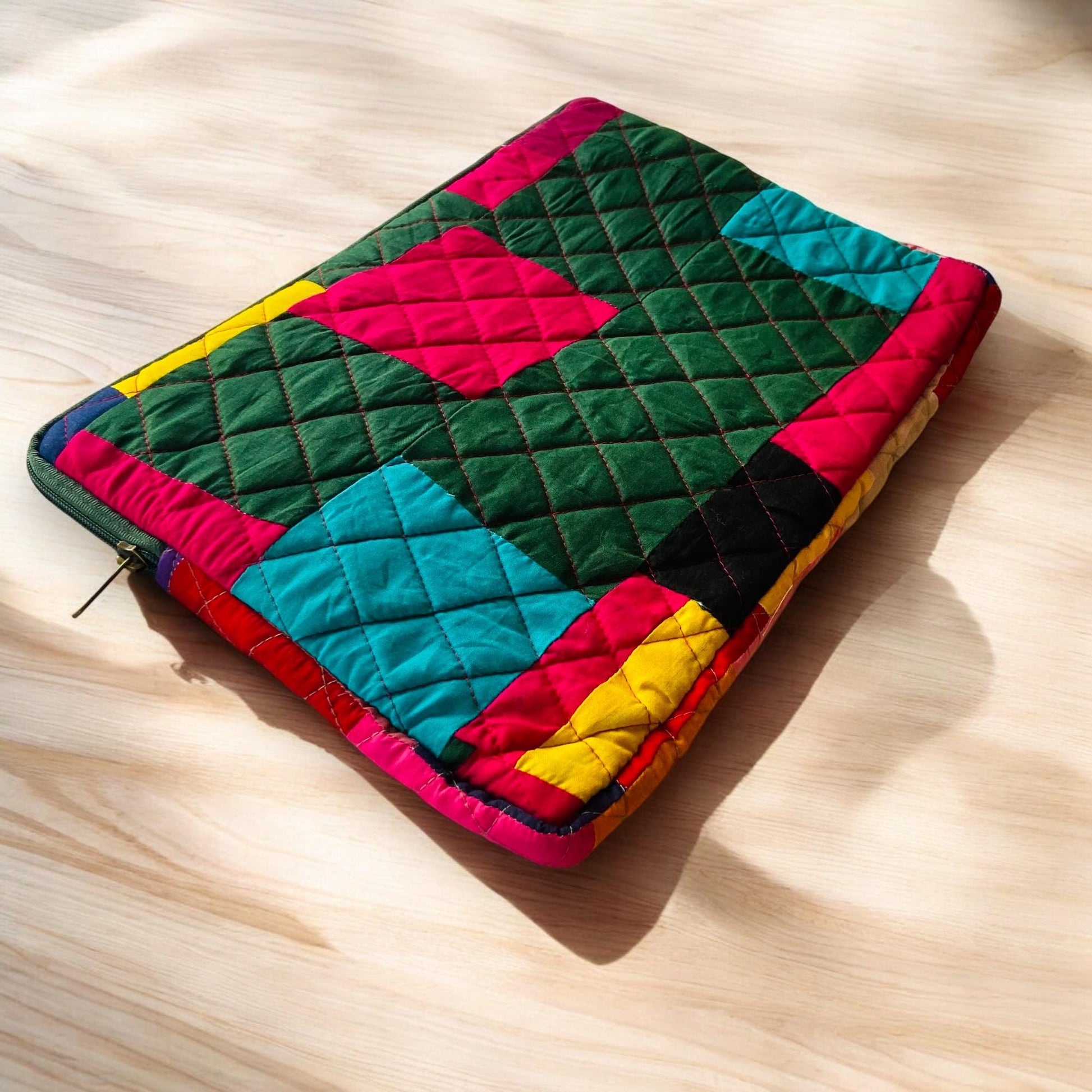 laptop cover, case cover for macbook air, cover for hp laptop, laptop sleeves all sizes, cute laptop sleeves, quilted laptop cover, puffy laptop sleeve, laptop sleeve 13 inch macbook air, laptop sleeve, laptop sleeve custom size, laptop cover 15 inch, An eco-friendly laptop sleeve showcasing a mix of vibrant, multicolor solid patchwork fabric pieces, creating a bold and eye-catching design. The quilted, puffy construction ensures your laptop is well-protected.